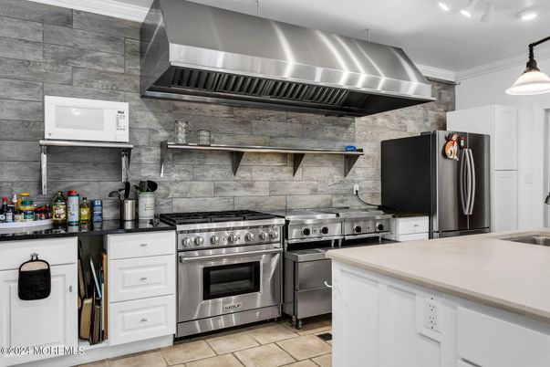 Interior, Kitchen, Pendant Lights, Stainless Steel Appliances, Stone Walls