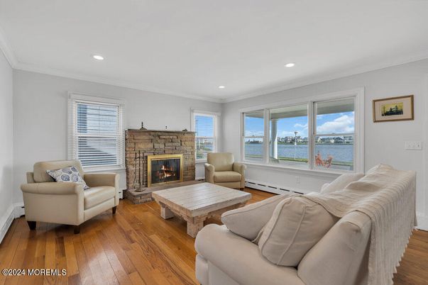 Fireplace, Interior, Living room, Recessed Lighting, Water, Wood Texture Flooring