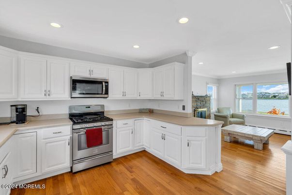 Interior, Kitchen, Recessed Lighting, Stainless Steel Appliances, Water, Wood Texture Flooring