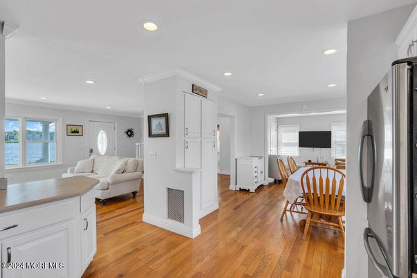 Dining room, Interior, Kitchen, Living room, Recessed Lighting, Water, Wood Texture Flooring