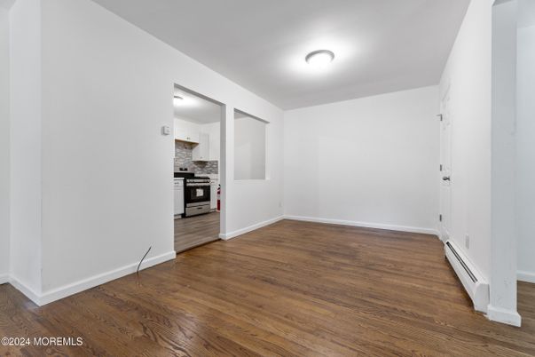 Empty room, Interior, Kitchen, Stainless Steel Appliances, Wood Texture Flooring