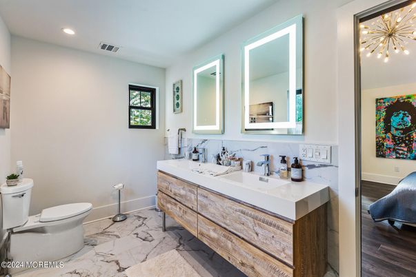 Bathroom, Dual Sink Vanities, Interior, Marble, Recessed Lighting, Wood Texture Flooring