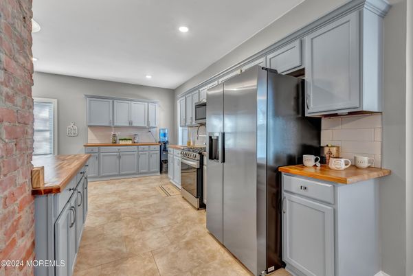 Interior, Kitchen, Recessed Lighting, Stainless Steel Appliances, Stone Walls