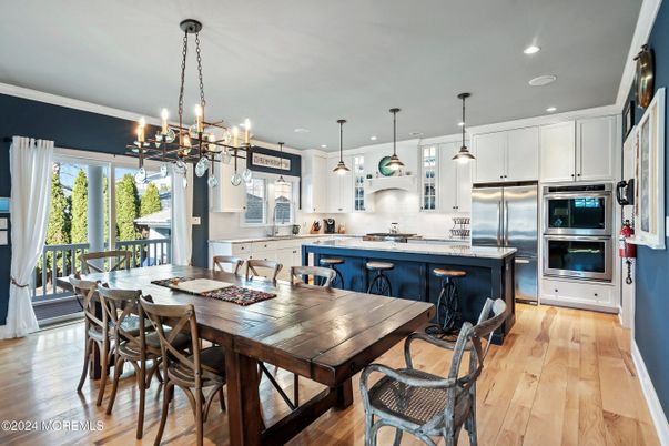 Dining room, Interior, Kitchen, Pendant Lights, Recessed Lighting, Stainless Steel Appliances, Wood Texture Flooring