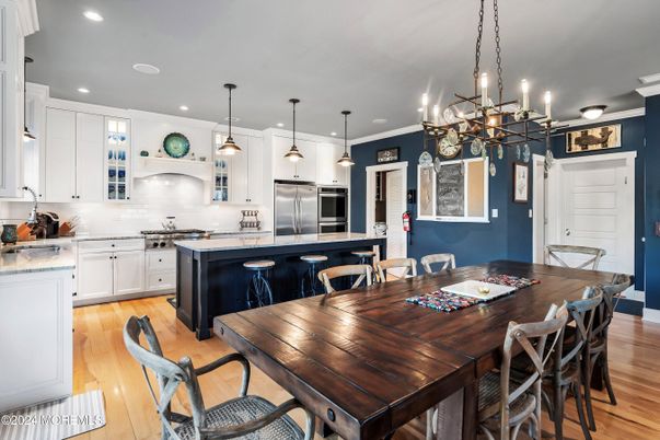 Dining room, Interior, Kitchen, Pendant Lights, Recessed Lighting, Stainless Steel Appliances, Wood Texture Flooring