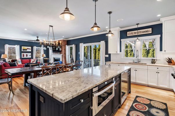 Dining room, Fireplace, Interior, Kitchen, Living room, Pendant Lights, Recessed Lighting, Wood Texture Flooring