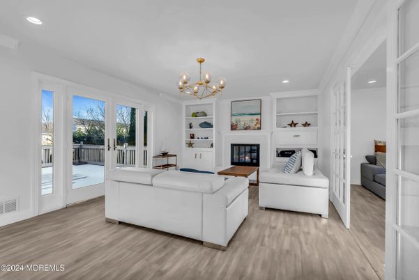 Chandelier, Fireplace, Interior, Living room, Recessed Lighting, Wood Texture Flooring