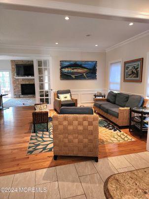 Fireplace, Interior, Living room, Recessed Lighting, Stone Walls, Wood Texture Flooring