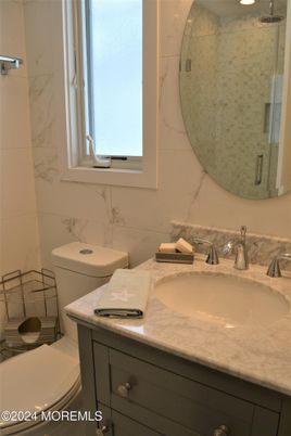 Bathroom, Dual Sink Vanities, Glass Shower, Interior, Marble Walls