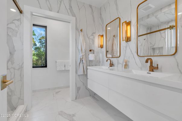 Bathroom, Dual Sink Vanities, Interior, Marble, Marble Walls, Recessed Lighting