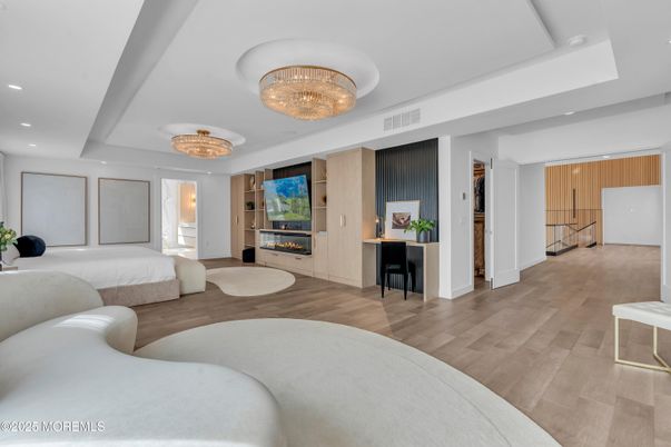 Bedroom, Chandelier, Fireplace, Interior, Recessed Lighting, Wood Texture Flooring