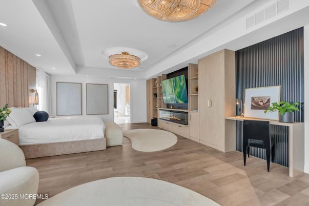 Bedroom, Chandelier, Fireplace, Interior, Recessed Lighting, Wood Texture Flooring