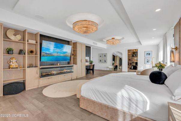 Bedroom, Chandelier, Fireplace, Interior, Recessed Lighting, Wood Texture Flooring