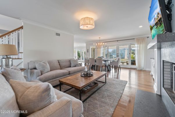 Dining room, Fireplace, Interior, Living room, Pendant Lights, Recessed Lighting, Wood Texture Flooring