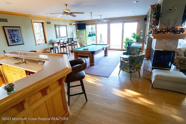 Billiard Table, Fireplace, Game Room, Interior, Recessed Lighting, Wood Texture Flooring