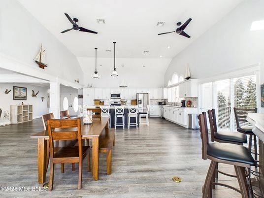 Dining room, Interior, Kitchen, Pendant Lights, Recessed Lighting, Stainless Steel Appliances, Wood Texture Flooring