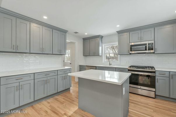 Interior, Kitchen, Recessed Lighting, Stainless Steel Appliances, Wood Texture Flooring