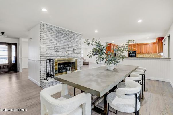 Dining room, Fireplace, Interior, Kitchen, Recessed Lighting, Stone Walls, Wood Texture Flooring