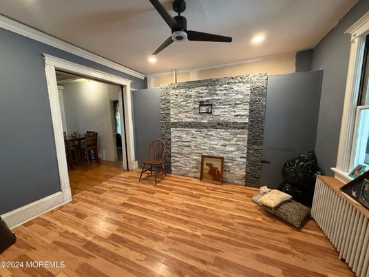 Fireplace, Interior, Recessed Lighting, Stone Walls, Wood Texture Flooring