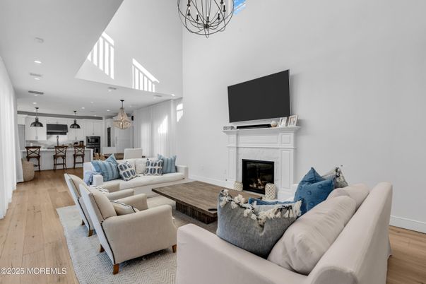 Chandelier, Dining room, Fireplace, Interior, Kitchen, Living room, Pendant Lights, Recessed Lighting, Wood Texture Flooring
