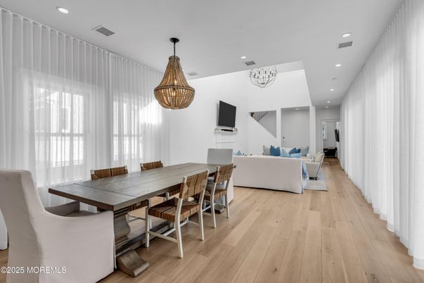 Chandelier, Dining room, Fireplace, Interior, Living room, Recessed Lighting, Wood Texture Flooring