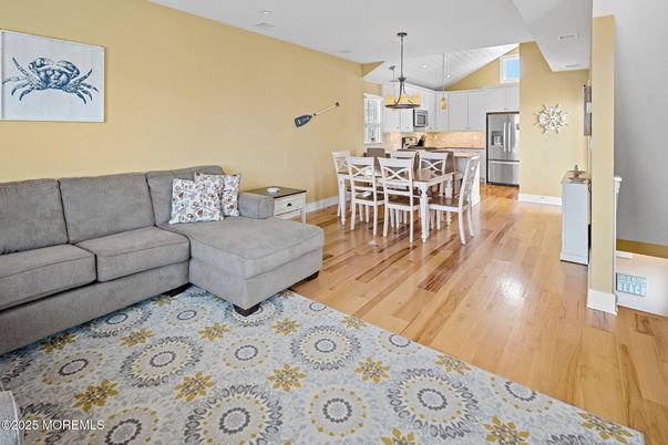 Dining room, Interior, Kitchen, Living room, Pendant Lights, Recessed Lighting, Stainless Steel Appliances, Wood Texture Flooring