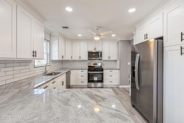 Interior, Kitchen, Recessed Lighting, Stainless Steel Appliances, Wood Texture Flooring
