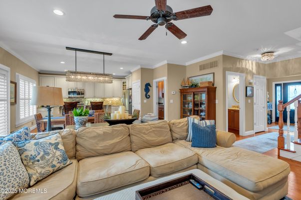 Chandelier, Interior, Kitchen, Living room, Pendant Lights, Recessed Lighting, Stainless Steel Appliances, Wood Texture Flooring