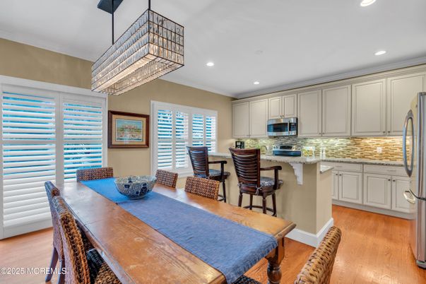 Chandelier, Dining room, Interior, Kitchen, Recessed Lighting, Stainless Steel Appliances, Wood Texture Flooring