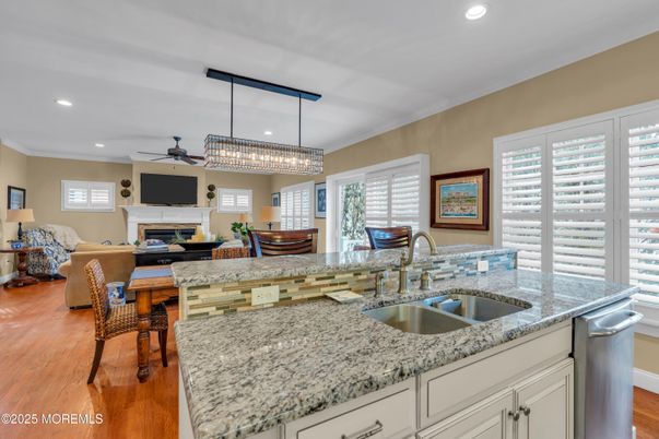 Chandelier, Dining room, Fireplace, Interior, Kitchen, Living room, Recessed Lighting, Wood Texture Flooring