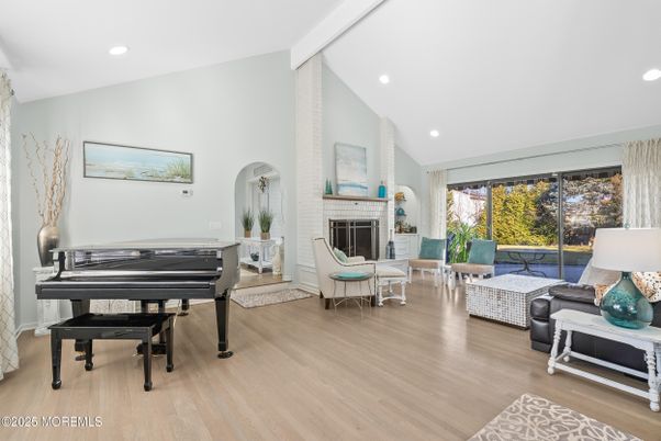 Fireplace, Interior, Living room, Piano, Recessed Lighting, Wood Texture Flooring