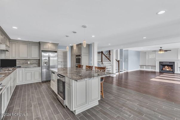 Fireplace, Interior, Kitchen, Pendant Lights, Recessed Lighting, Stainless Steel Appliances, Wood Texture Flooring