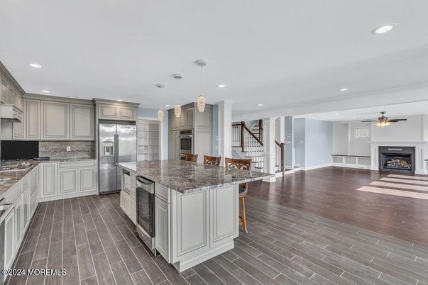 Fireplace, Interior, Kitchen, Pendant Lights, Recessed Lighting, Stainless Steel Appliances, Wood Texture Flooring