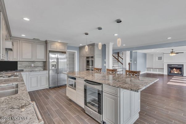 Fireplace, Interior, Kitchen, Pendant Lights, Recessed Lighting, Stainless Steel Appliances, Wood Texture Flooring