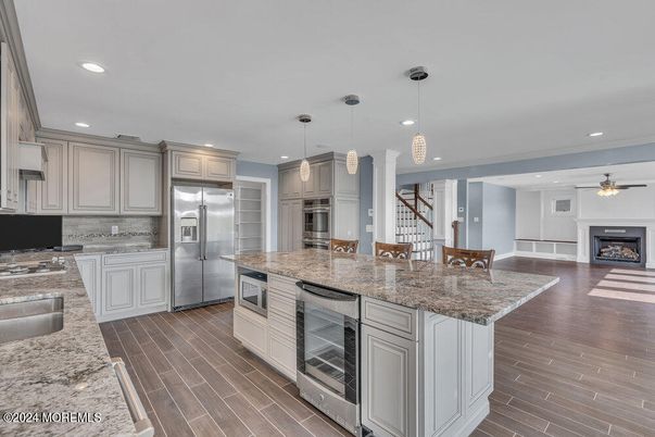 Fireplace, Interior, Kitchen, Pendant Lights, Recessed Lighting, Stainless Steel Appliances, Wood Texture Flooring
