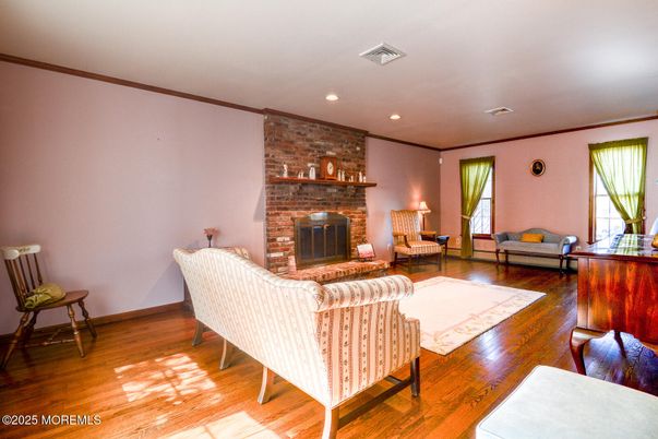 Fireplace, Interior, Living room, Recessed Lighting, Stone Walls, Wood Texture Flooring