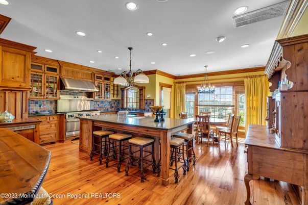 Chandelier, Dining room, Interior, Kitchen, Pendant Lights, Recessed Lighting, Stainless Steel Appliances, Wood Texture Flooring
