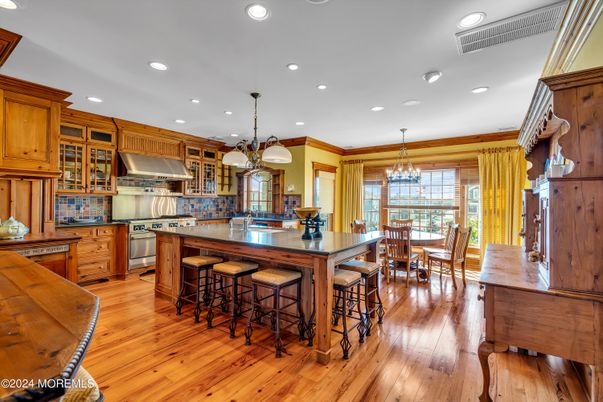Chandelier, Dining room, Interior, Kitchen, Pendant Lights, Recessed Lighting, Stainless Steel Appliances, Wood Texture Flooring