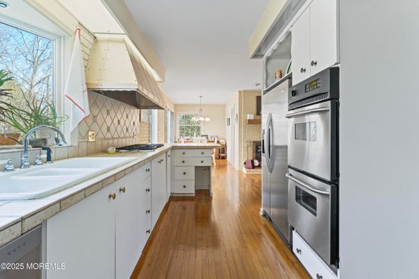 Interior, Kitchen, Pendant Lights, Stainless Steel Appliances, Tile Countertops, Wood Texture Flooring
