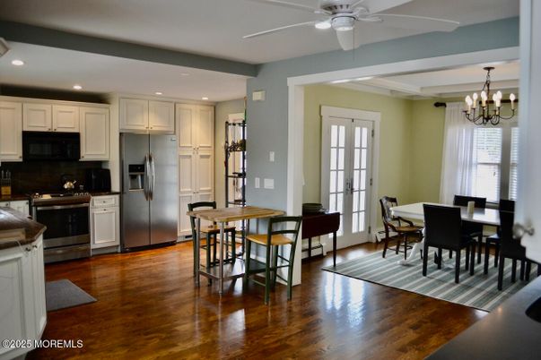 Chandelier, Dining room, Interior, Kitchen, Recessed Lighting, Stainless Steel Appliances, Wood Texture Flooring