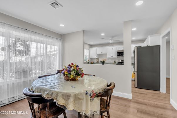 Dining room, Interior, Kitchen, Recessed Lighting, Stainless Steel Appliances, Wood Texture Flooring