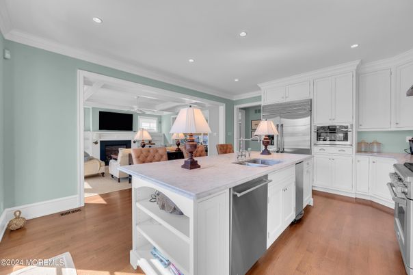 Fireplace, Interior, Kitchen, Recessed Lighting, Stainless Steel Appliances, Wood Texture Flooring
