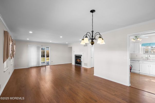 Chandelier, Empty room, Fireplace, Interior, Kitchen, Recessed Lighting, Wood Texture Flooring