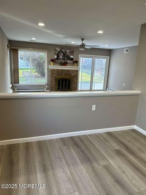 Empty room, Fireplace, Interior, Recessed Lighting, Wood Texture Flooring