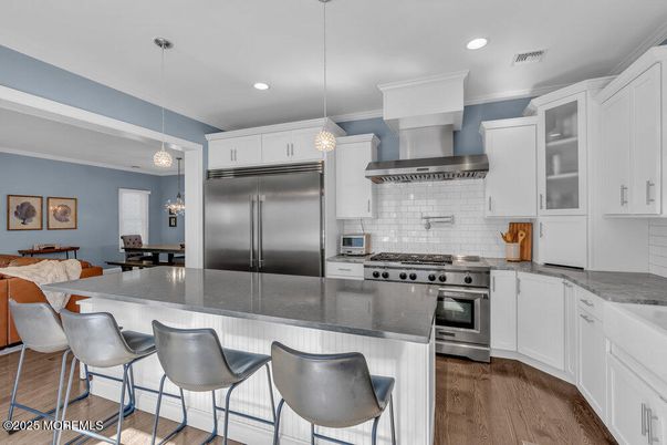 Dining room, Interior, Kitchen, Pendant Lights, Recessed Lighting, Stainless Steel Appliances, Wood Texture Flooring