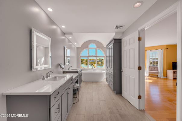 Bathroom, Dual Sink Vanities, Free Standing Baths, Interior, Recessed Lighting, Wood Texture Flooring