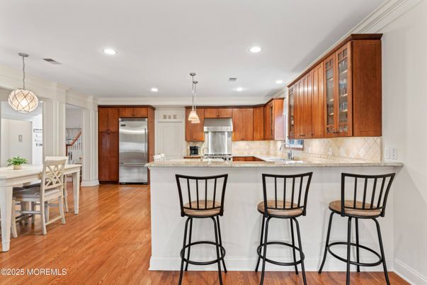 Dining room, Interior, Kitchen, Pendant Lights, Recessed Lighting, Stainless Steel Appliances, Wood Texture Flooring