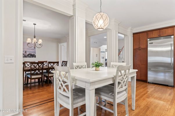 Chandelier, Dining room, Interior, Kitchen, Pendant Lights, Stainless Steel Appliances, Wood Texture Flooring