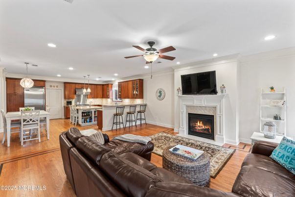 Dining room, Fireplace, Interior, Kitchen, Living room, Pendant Lights, Recessed Lighting, Stainless Steel Appliances, Wood Texture Flooring