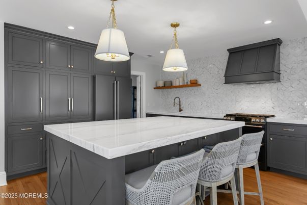 Interior, Kitchen, Marble Walls, Pendant Lights, Recessed Lighting, Stainless Steel Appliances, Wood Texture Flooring